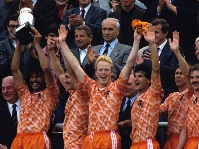 A winner . . . Ronald Koeman (centre) as Ruud Gullit lifts the 1988 European Championship trophy